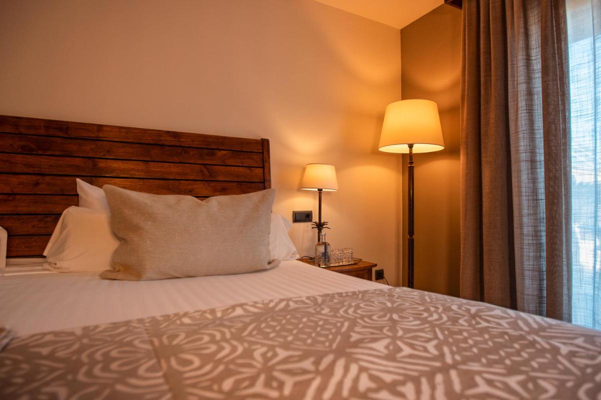 Cama o camas de una habitación en SWISS MORAIRA HOTEL & SPA - Adults only