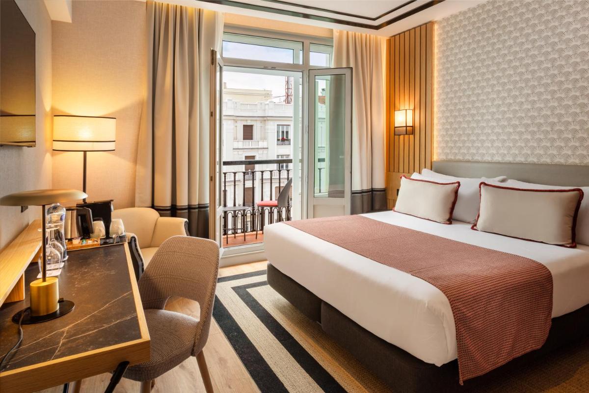 Cama o camas de una habitación en Catalonia Plaza España Hotel & Spa