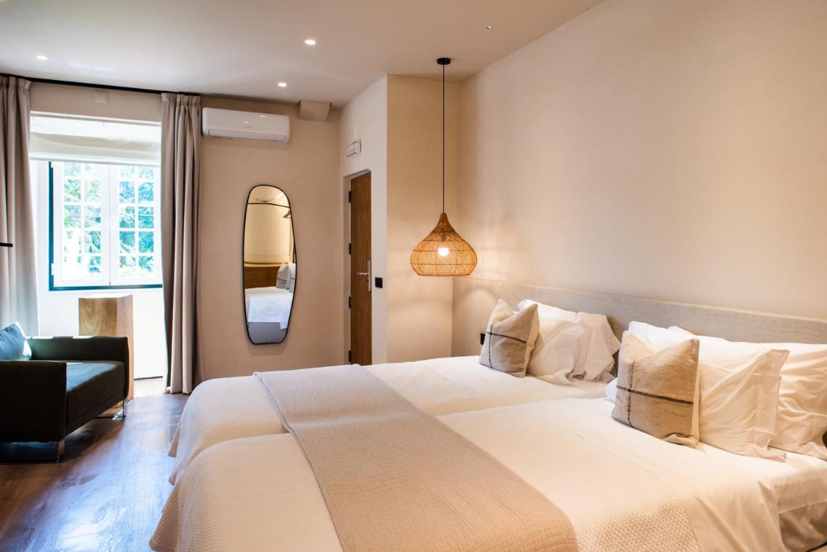 Uma cama ou camas num quarto em DOMA Portugal