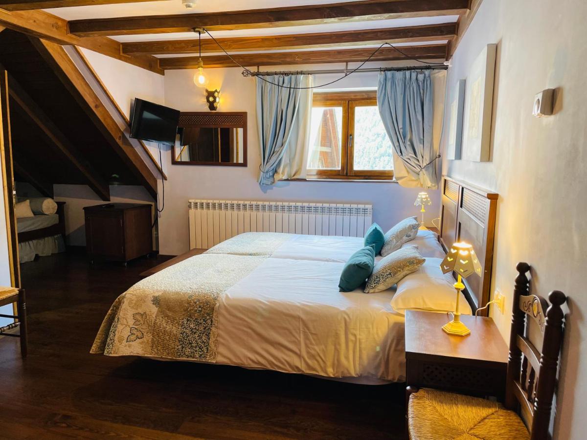 Cama o camas de una habitación en Tierras De Arán