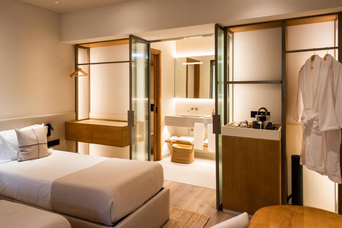 Uma cama ou camas num quarto em DOMA Portugal
