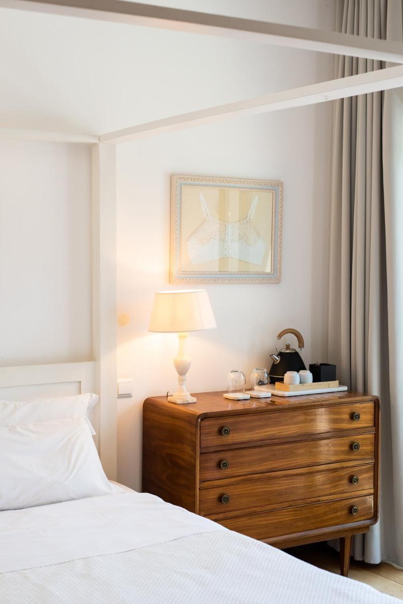 Uma cama ou camas num quarto em DOMA Portugal