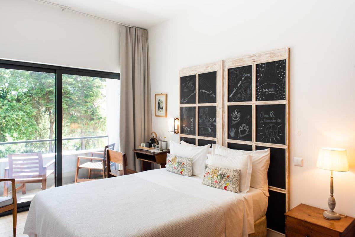 Uma cama ou camas num quarto em DOMA Portugal