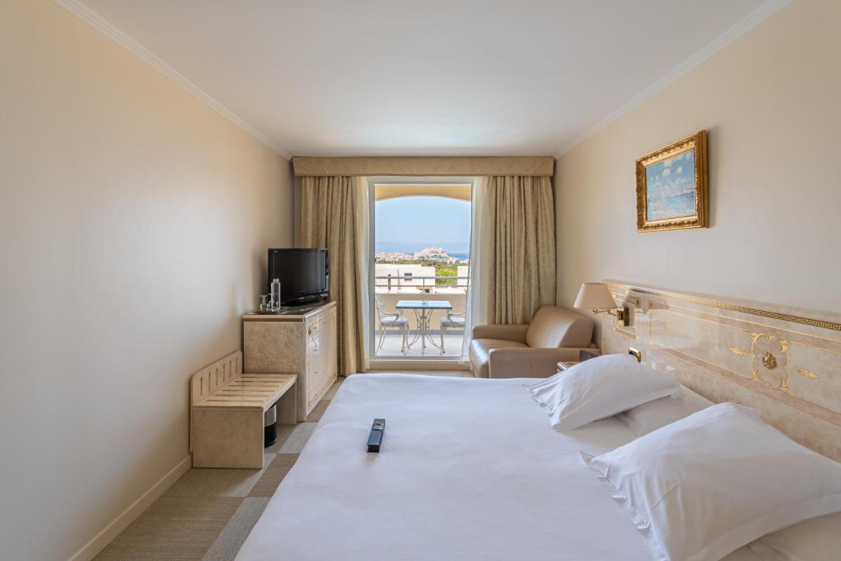 Un ou plusieurs lits dans un hébergement de l'établissement Hotel Corsica & Spa Serena