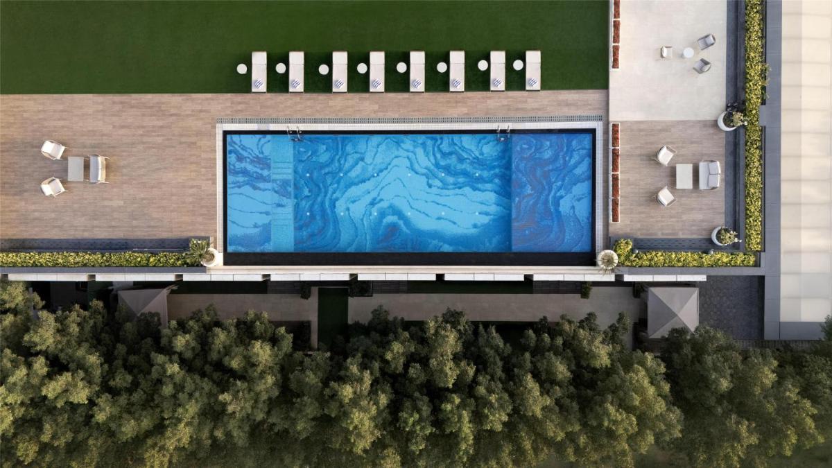 an overhead view of a building with a large screen at Hilton Gurugram Baani City Centre in Gurgaon