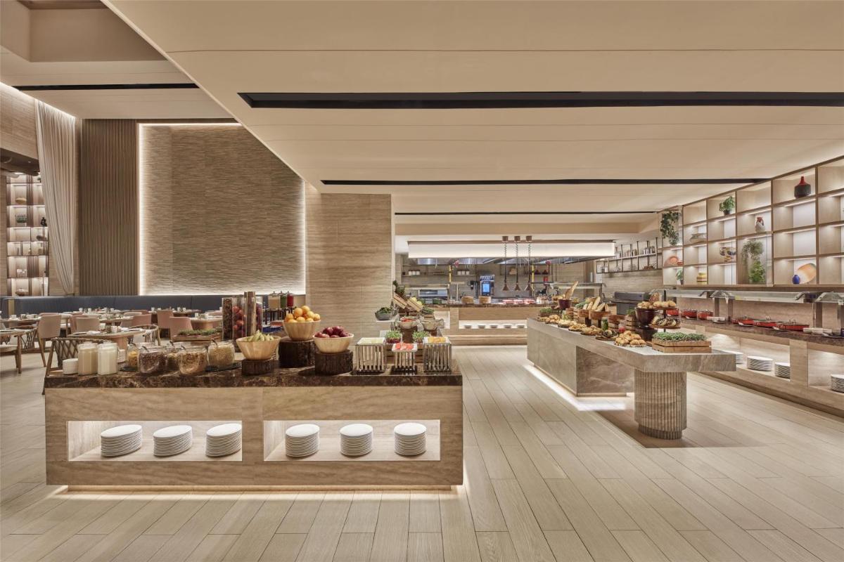 a rendering of a food court in a restaurant at Hilton Gurugram Baani City Centre in Gurgaon