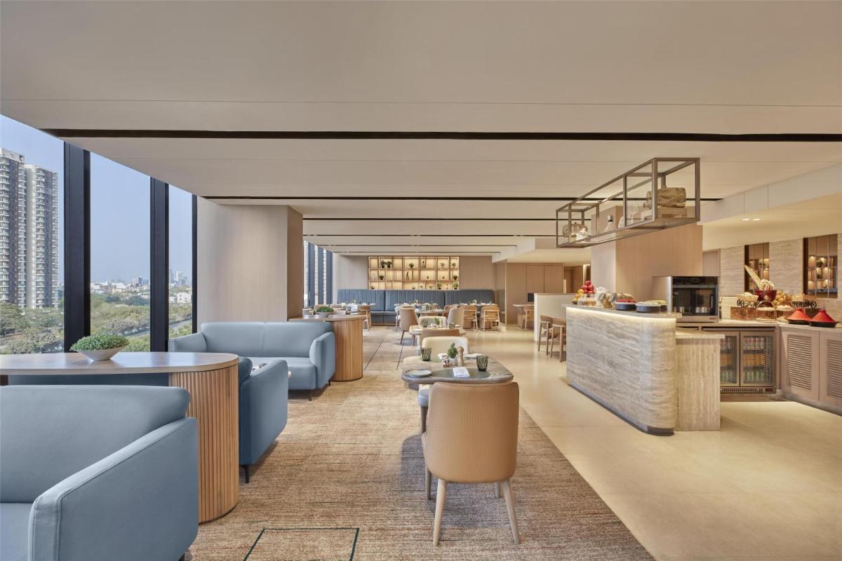 a rendering of the lobby of a planned hotel at Hilton Gurugram Baani City Centre in Gurgaon