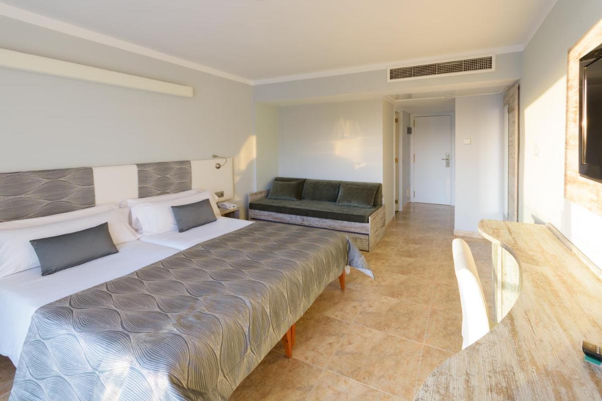Cama o camas de una habitación en Hotel Bahia del Sol