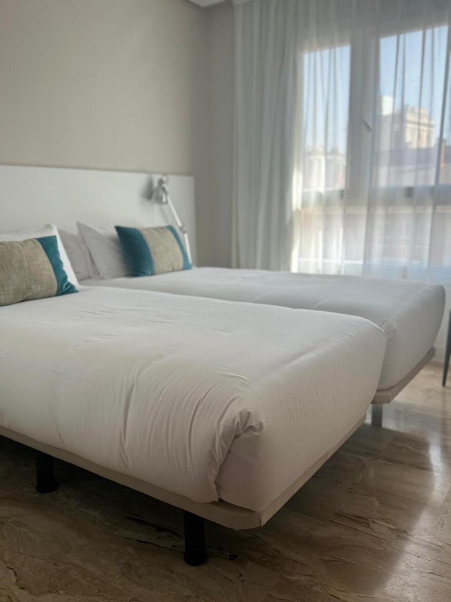 Cama o camas de una habitación en Aparthotel Los Girasoles