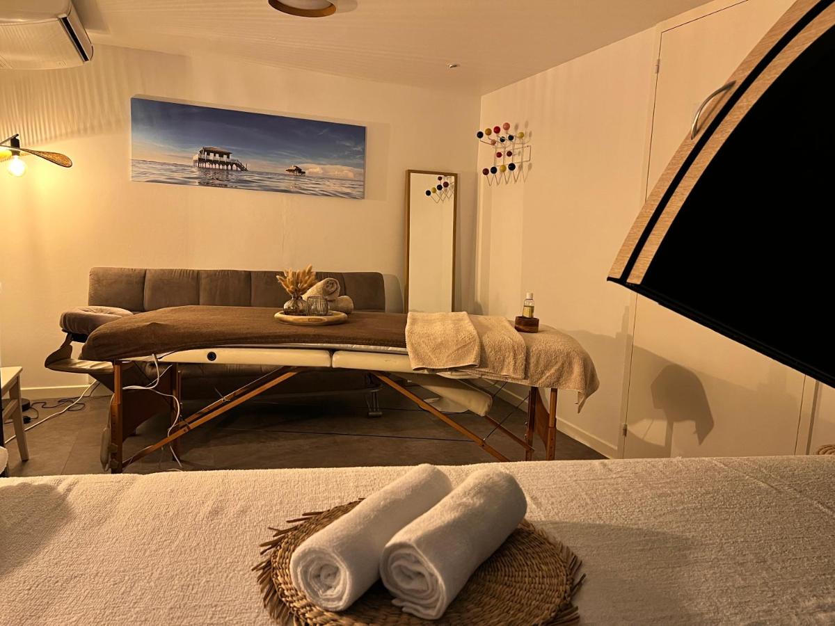 Un ou plusieurs lits dans un hébergement de l'établissement Hôtel Point France