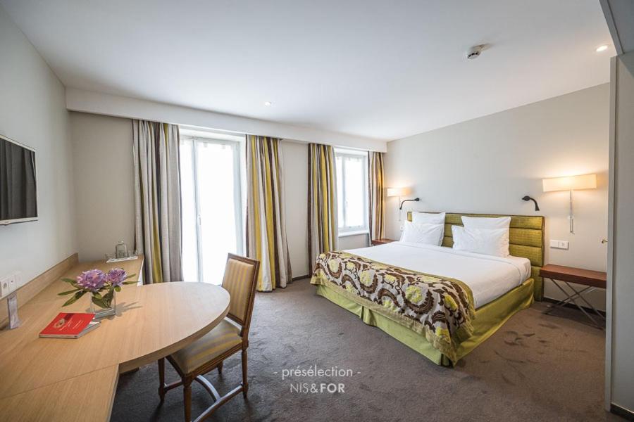 Un ou plusieurs lits dans un hébergement de l'établissement 6717 Nature Hôtel & Spa Le Clos des Délices