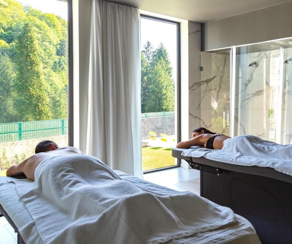 Un ou plusieurs lits dans un hébergement de l'établissement 6717 Nature Hôtel & Spa Le Clos des Délices