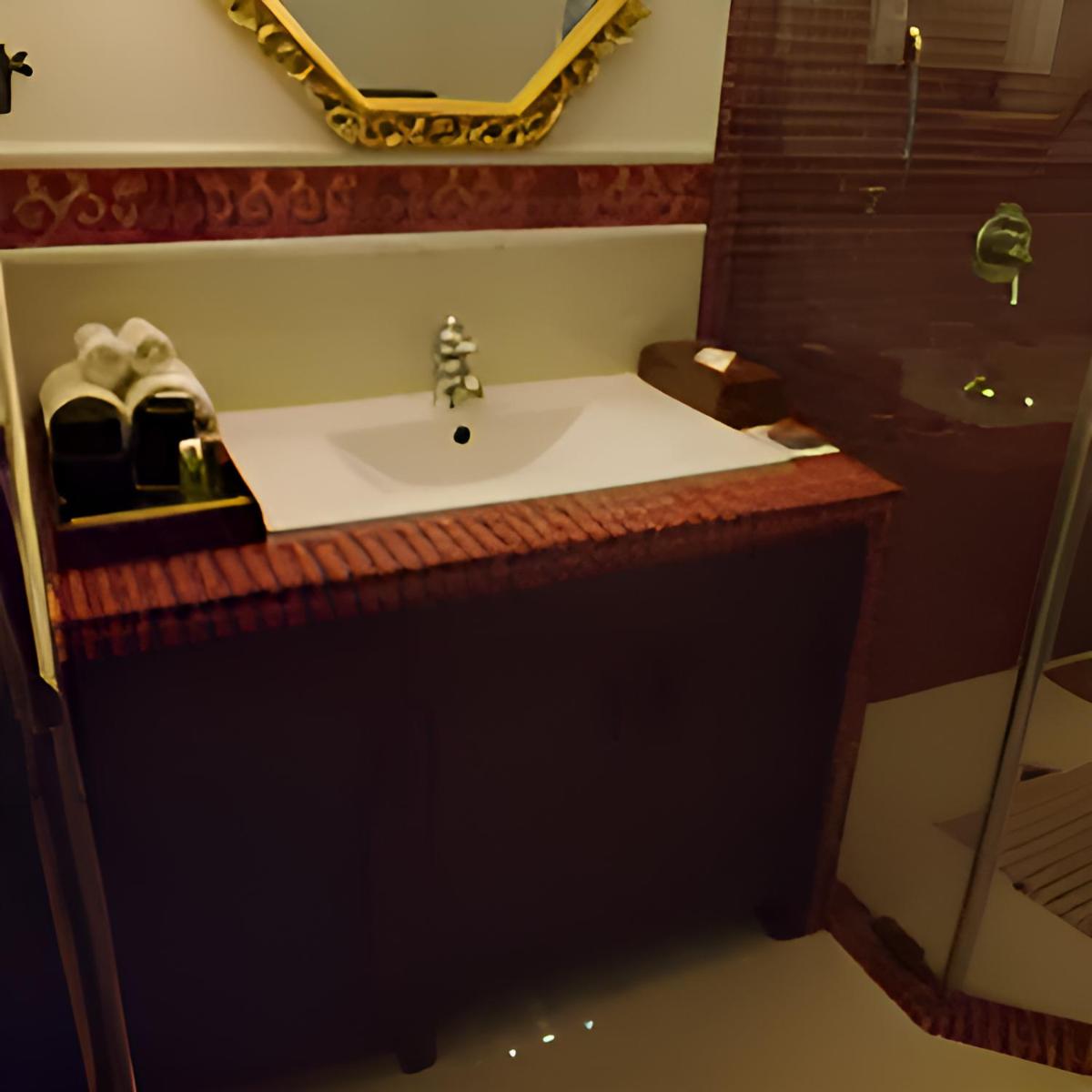 a bathroom with a sink and a mirror at The Postcard Cuelim, Goa in Cansaulim