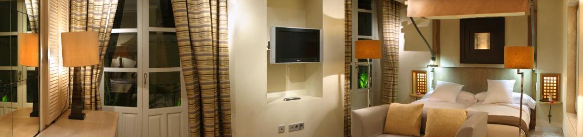 Una televisión o centro de entretenimiento en Villa Oniria