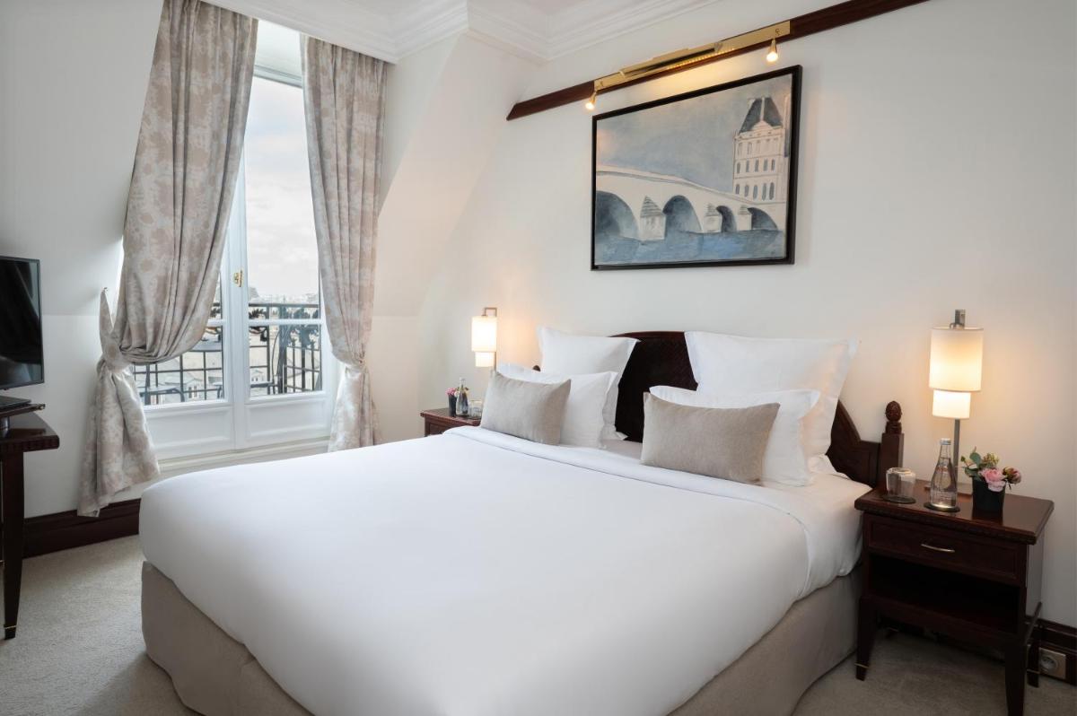 Un ou plusieurs lits dans un hébergement de l'établissement Hôtel Pont Royal Paris