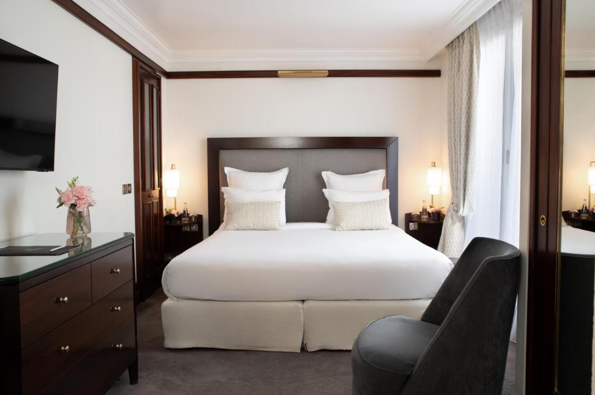 Un ou plusieurs lits dans un hébergement de l'établissement Hôtel Pont Royal Paris