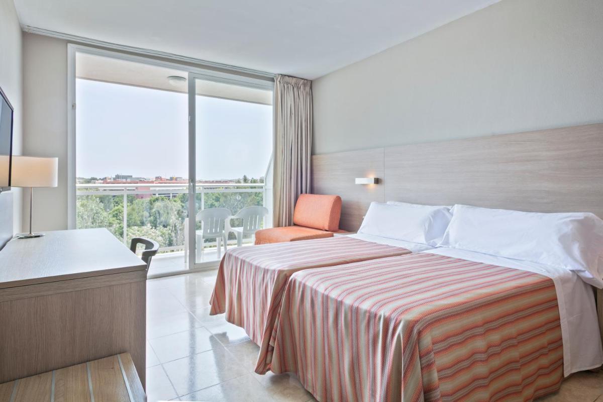 Cama o camas de una habitación en Sol Costa Daurada