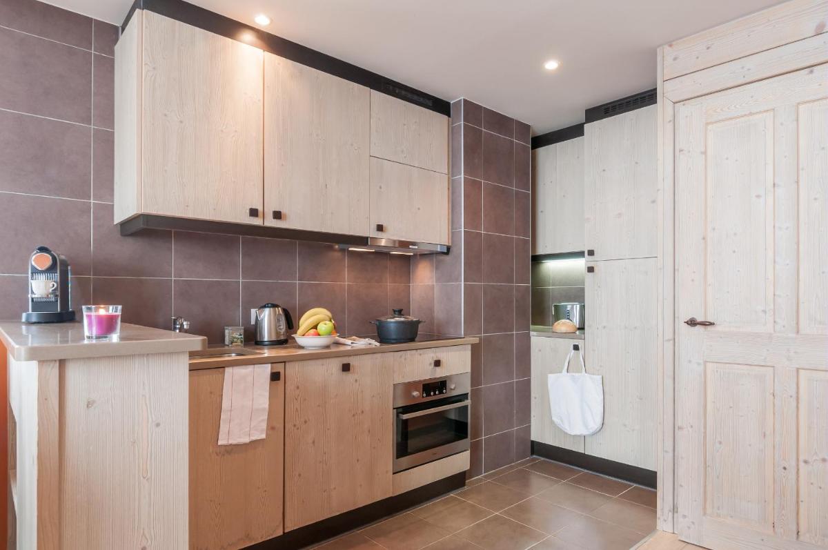 Cuisine ou kitchenette dans l'établissement Résidence Pierre & Vacances Premium L'Amara