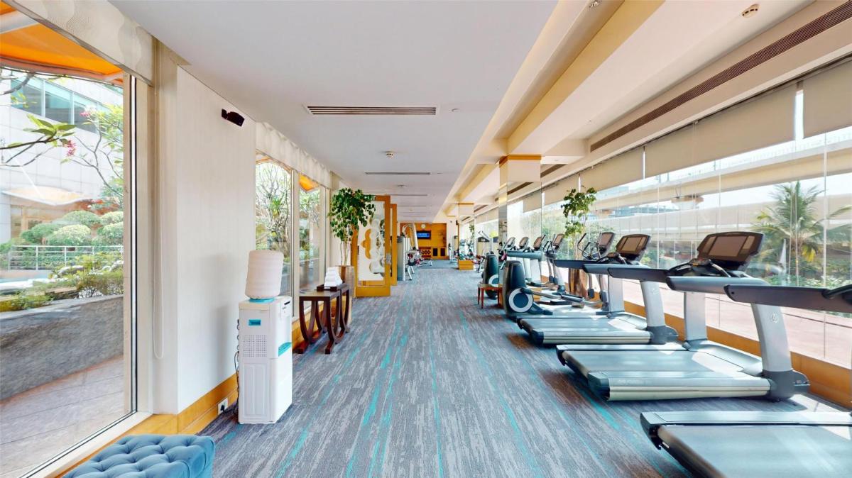 a row of treadmills in a gym at Radisson Blu Hotel, Nagpur in Nagpur