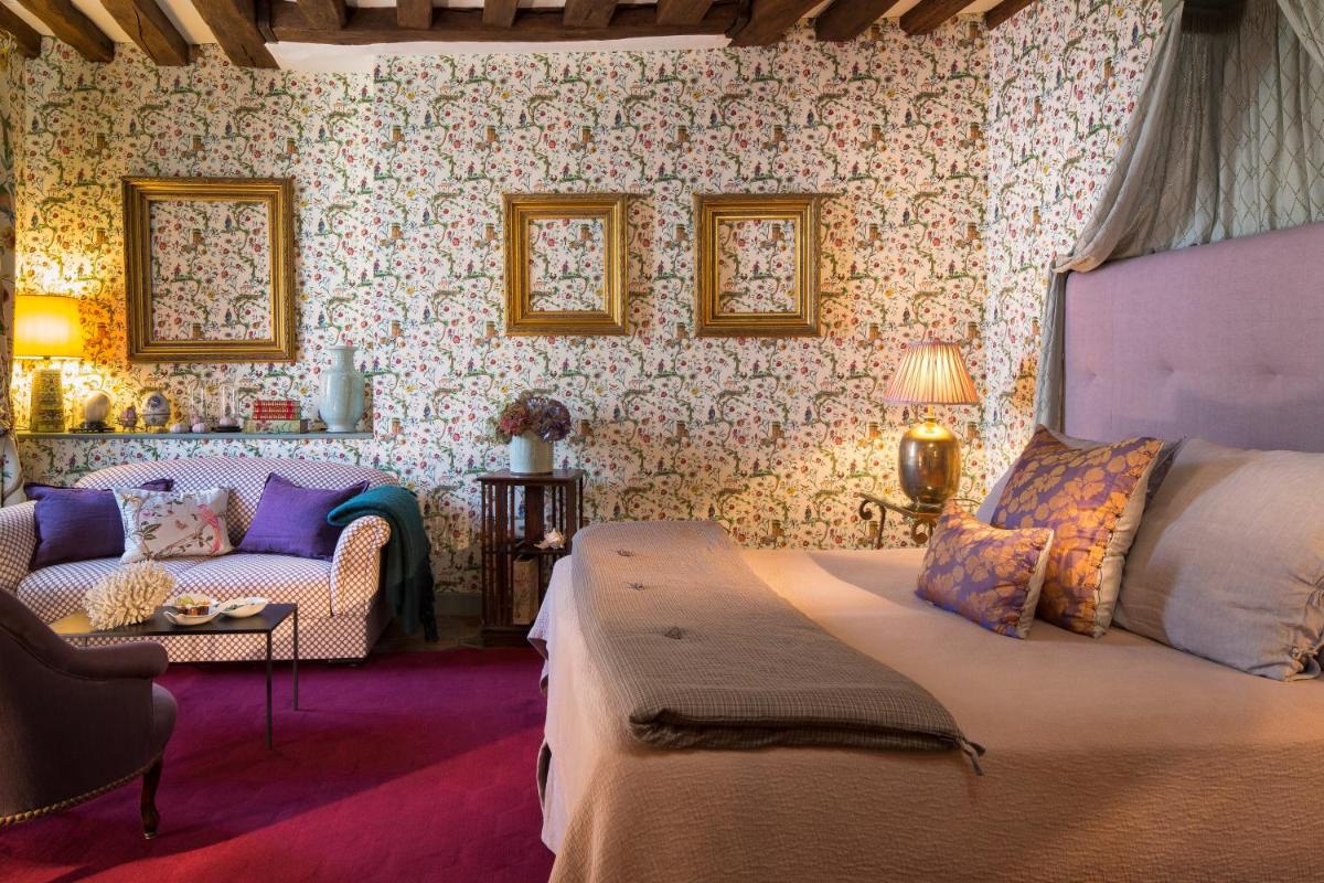 Un ou plusieurs lits dans un hébergement de l'établissement Hotel De France