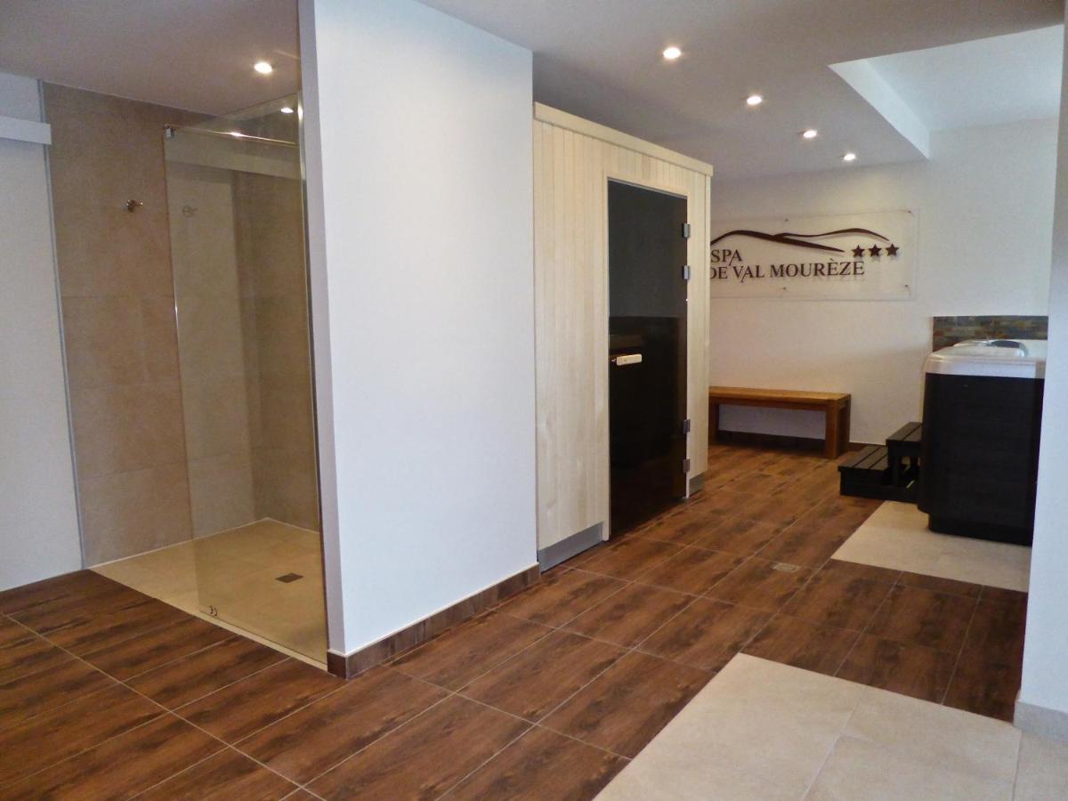 Un ou plusieurs lits dans un hébergement de l'établissement Auberge Val Moureze Hôtel & Spa