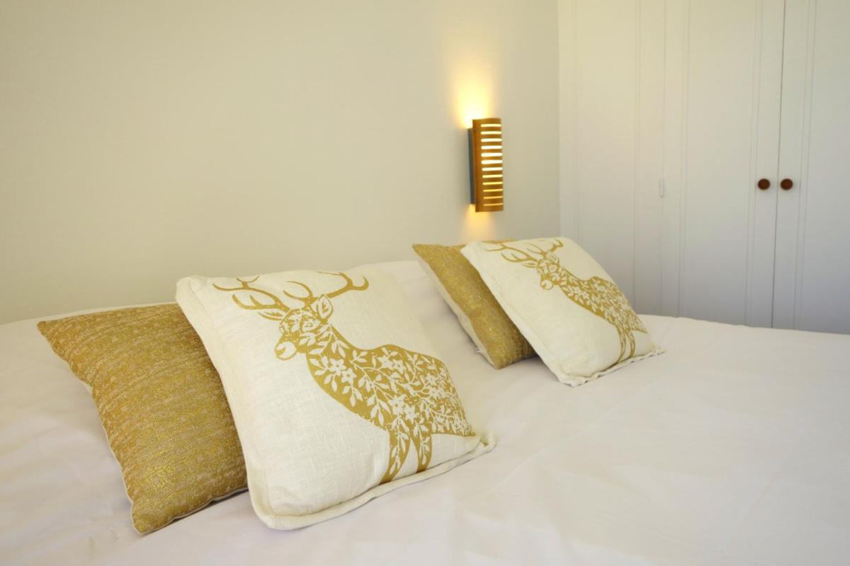 Un ou plusieurs lits dans un hébergement de l'établissement Hôtel La Ségalière Spa Bar
