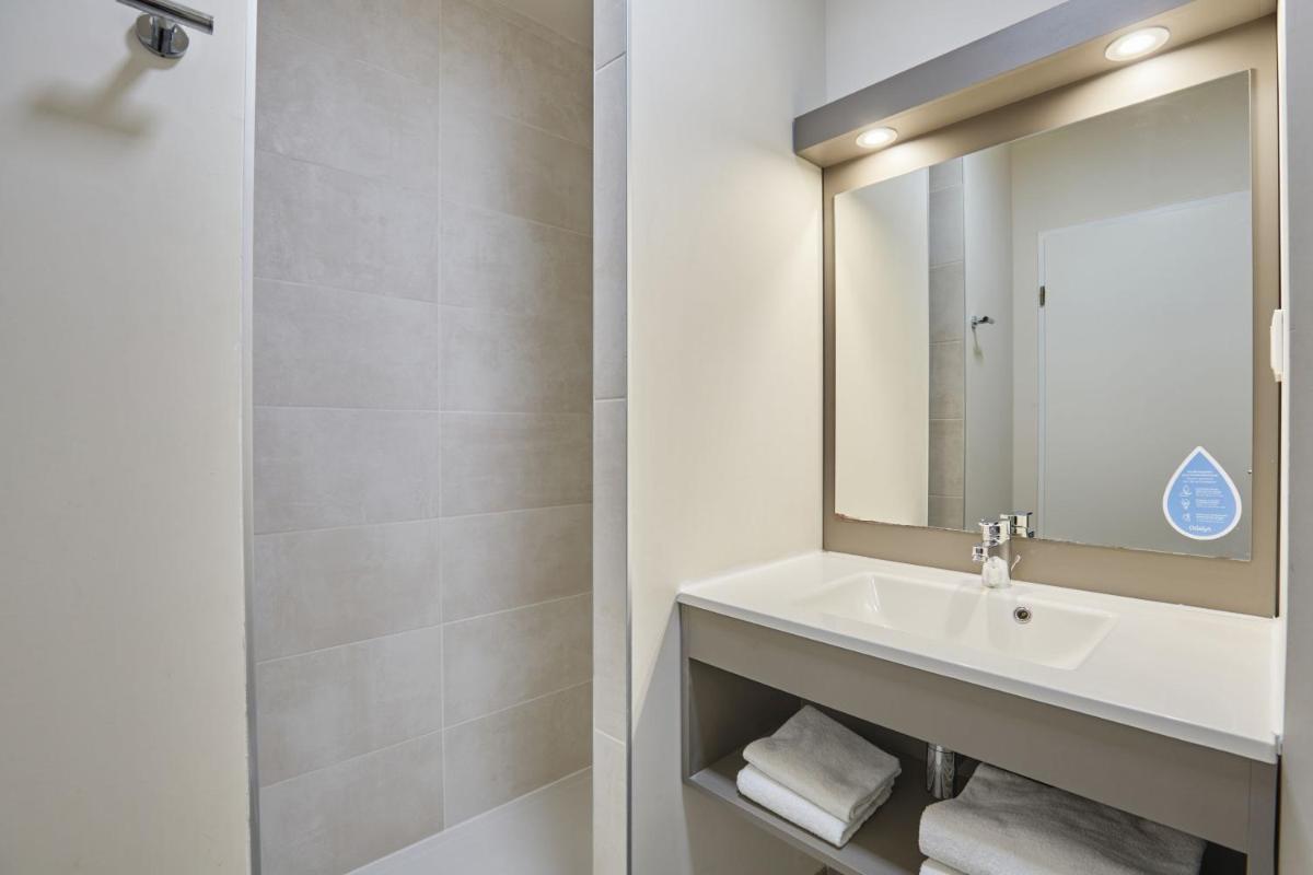 Salle de bains dans l'établissement Résidence Odalys Les Canissons
