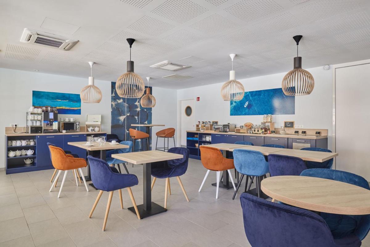 Restaurant ou autre lieu de restauration dans l'établissement Résidence Odalys Les Canissons