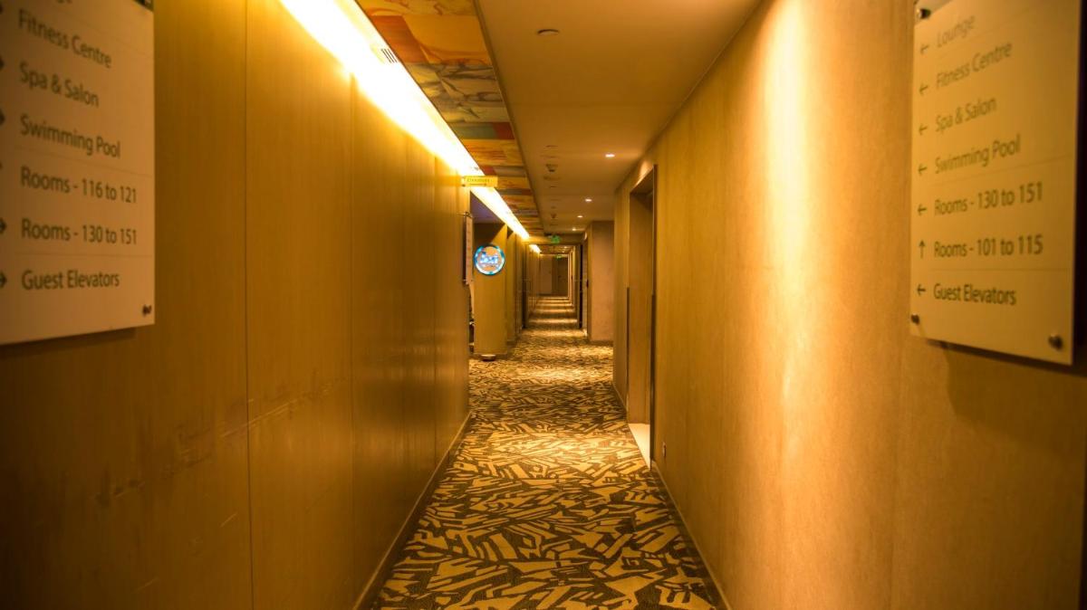a corridor of a hallway with a long hallway at Holiday Inn New Delhi Aerocity by IHG in New Delhi