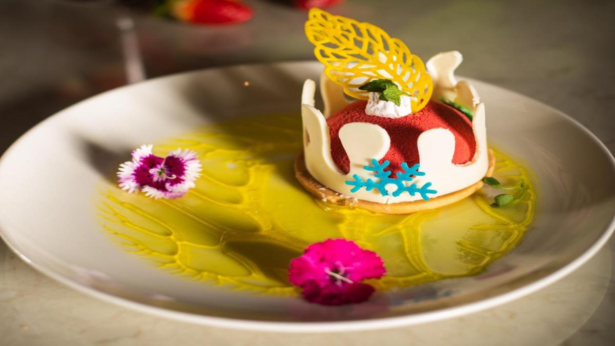 a yellow cake with a bird on top of it at Holiday Inn New Delhi Aerocity by IHG in New Delhi