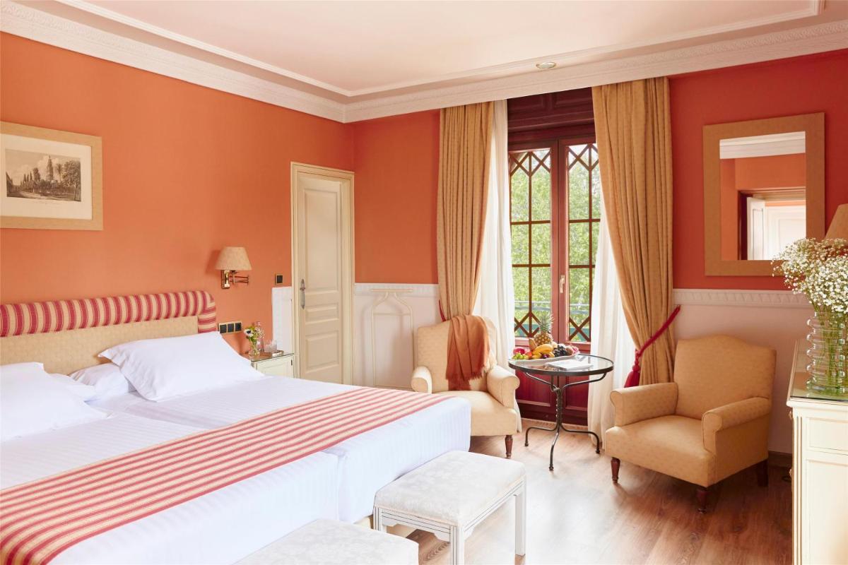 Cama o camas de una habitación en Alhambra Palace Hotel