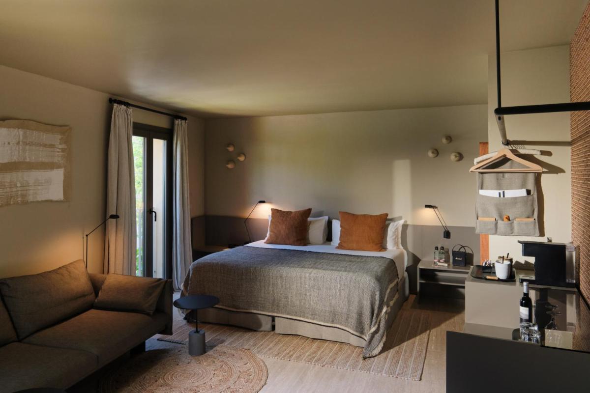 Cama o camas de una habitación en Can Aulí Luxury Retreat - Adults Only
