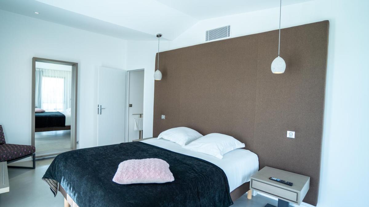 Un ou plusieurs lits dans un hébergement de l'établissement Les Villas du Parc de la Chabotterie