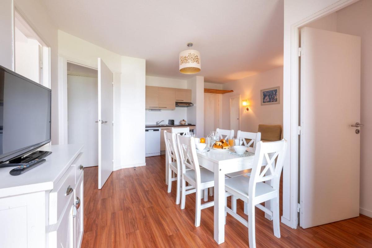 Cuisine ou kitchenette dans l'établissement Résidence Odalys Fleur de Sel