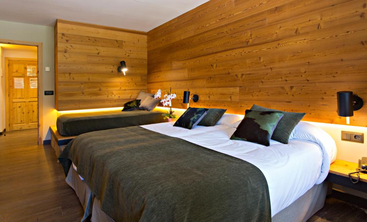 Cama o camas de una habitación en Hotel La Coma
