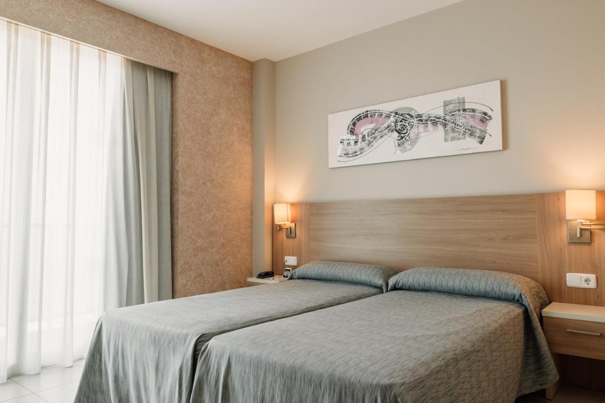 Cama o camas de una habitación en Hotel Lodomar Spa & Talasoterapia