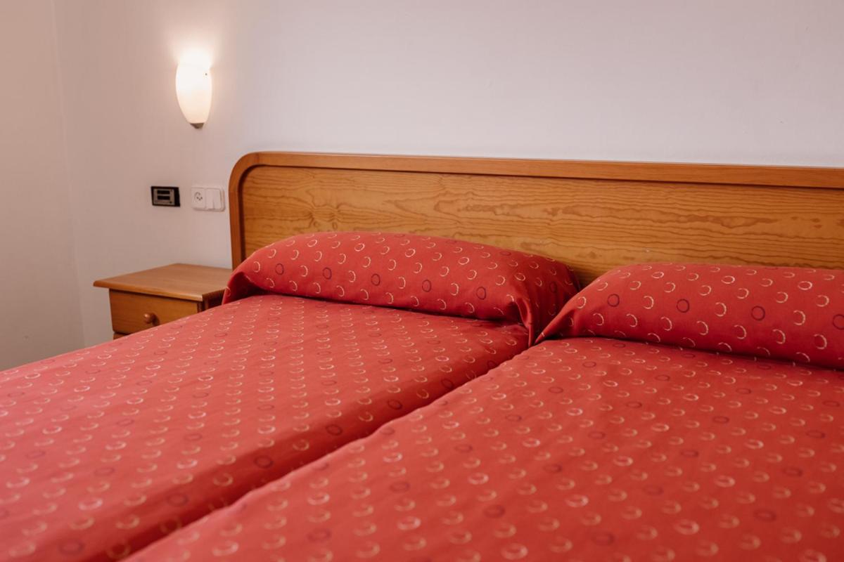 Cama o camas de una habitación en Hotel Lodomar Spa & Talasoterapia