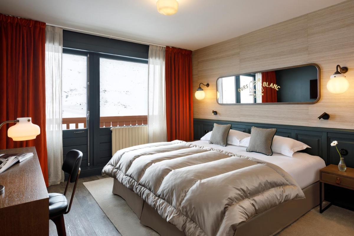 Un ou plusieurs lits dans un hébergement de l'établissement Ours Blanc Hotel & Spa