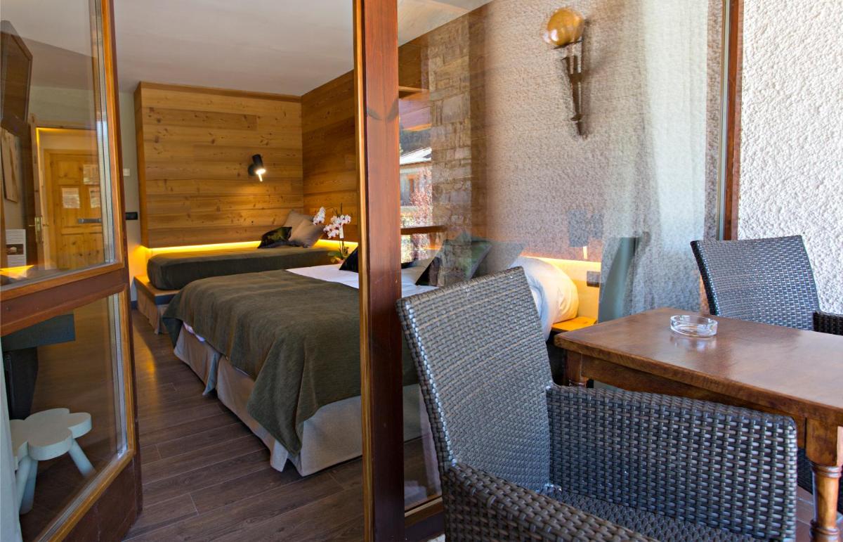 Cama o camas de una habitación en Hotel La Coma