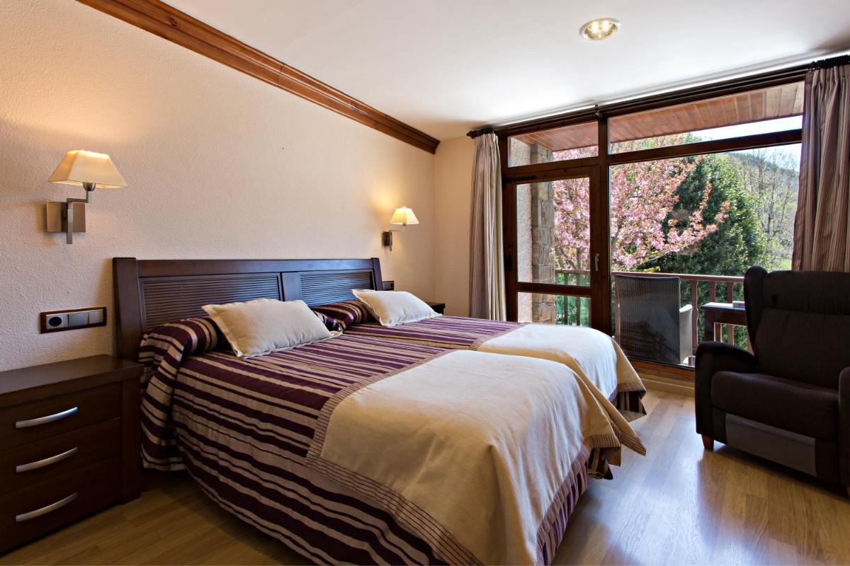 Cama o camas de una habitación en Hotel La Coma