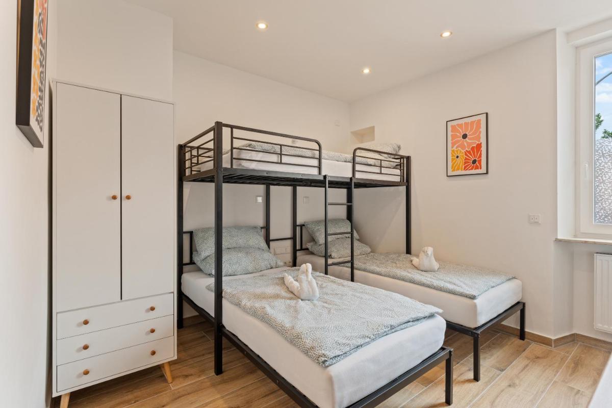 Ein Bett oder Betten in einem Zimmer der Unterkunft Family and Friends Hassloch