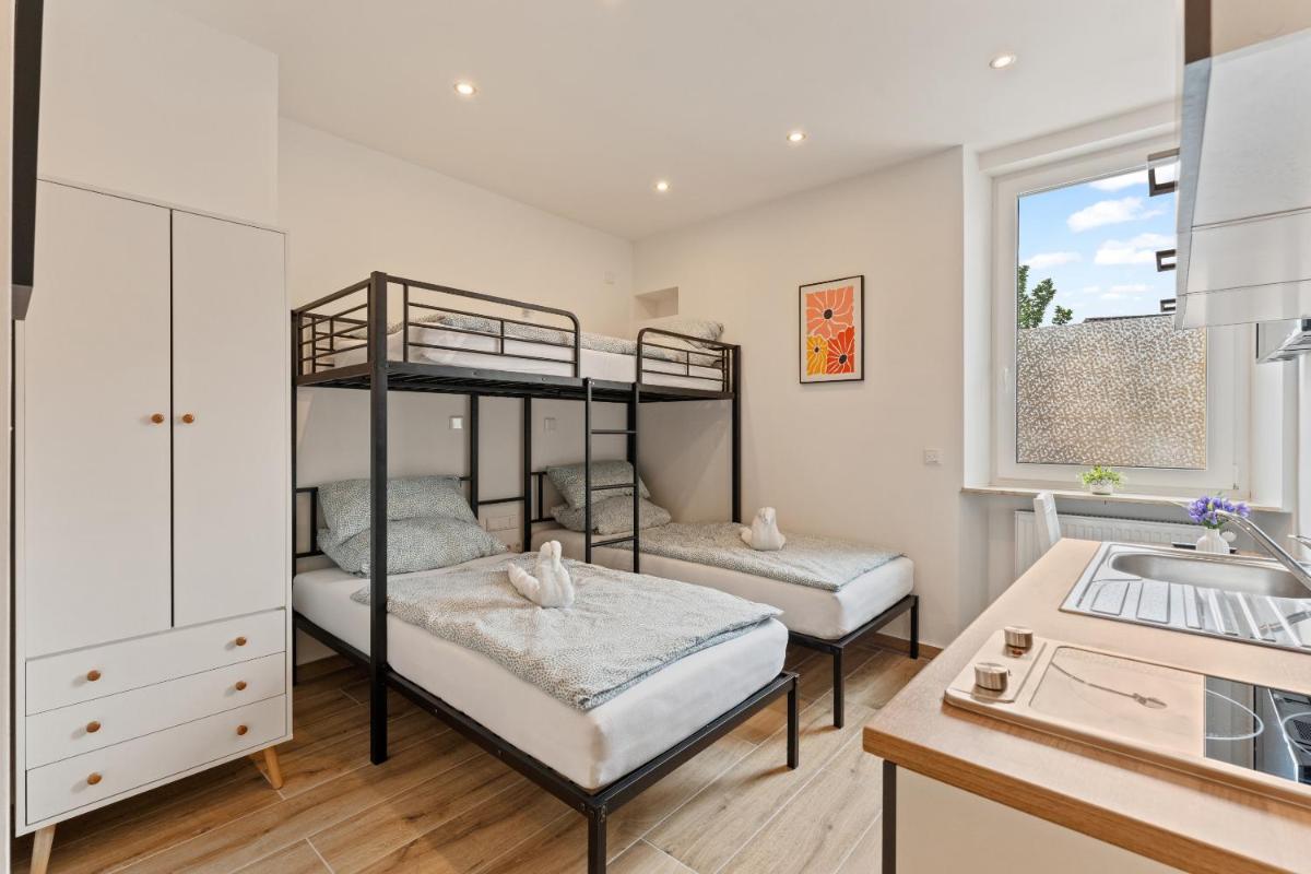 Ein Bett oder Betten in einem Zimmer der Unterkunft Family and Friends Hassloch
