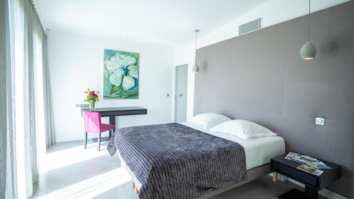 Un ou plusieurs lits dans un hébergement de l'établissement Les Villas du Parc de la Chabotterie