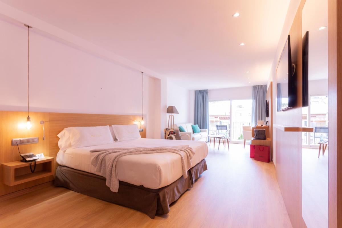 Cama o camas de una habitación en Hotel Saratoga