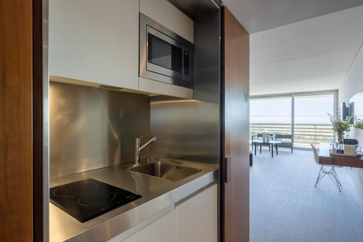 A cozinha ou kitchenette de Troia Design Hotel