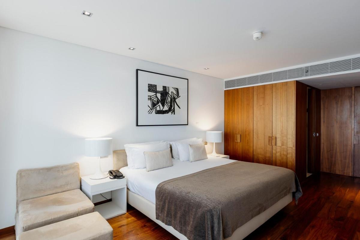 Uma cama ou camas num quarto em Troia Design Hotel