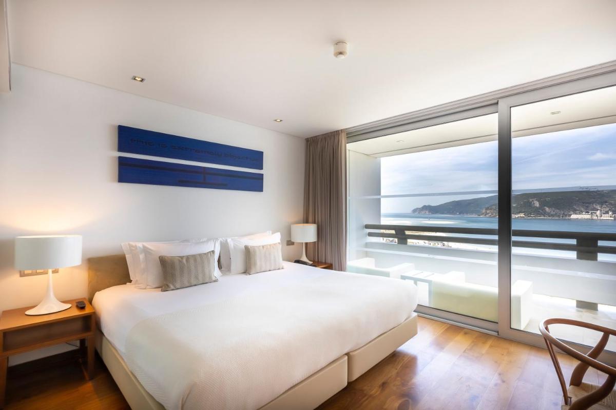 Uma cama ou camas num quarto em Troia Design Hotel