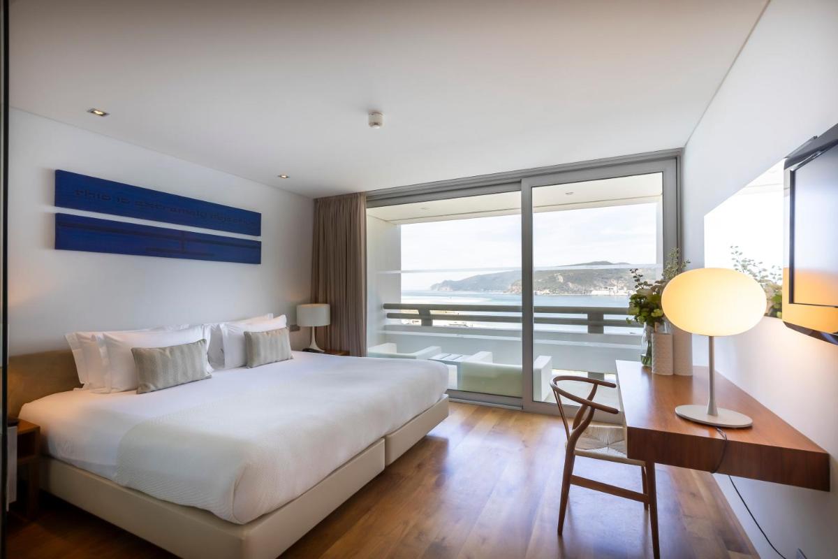 Uma cama ou camas num quarto em Troia Design Hotel