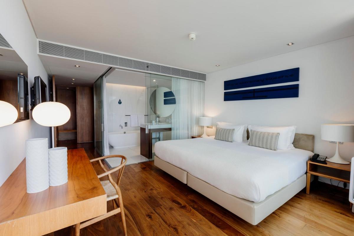 Uma cama ou camas num quarto em Troia Design Hotel