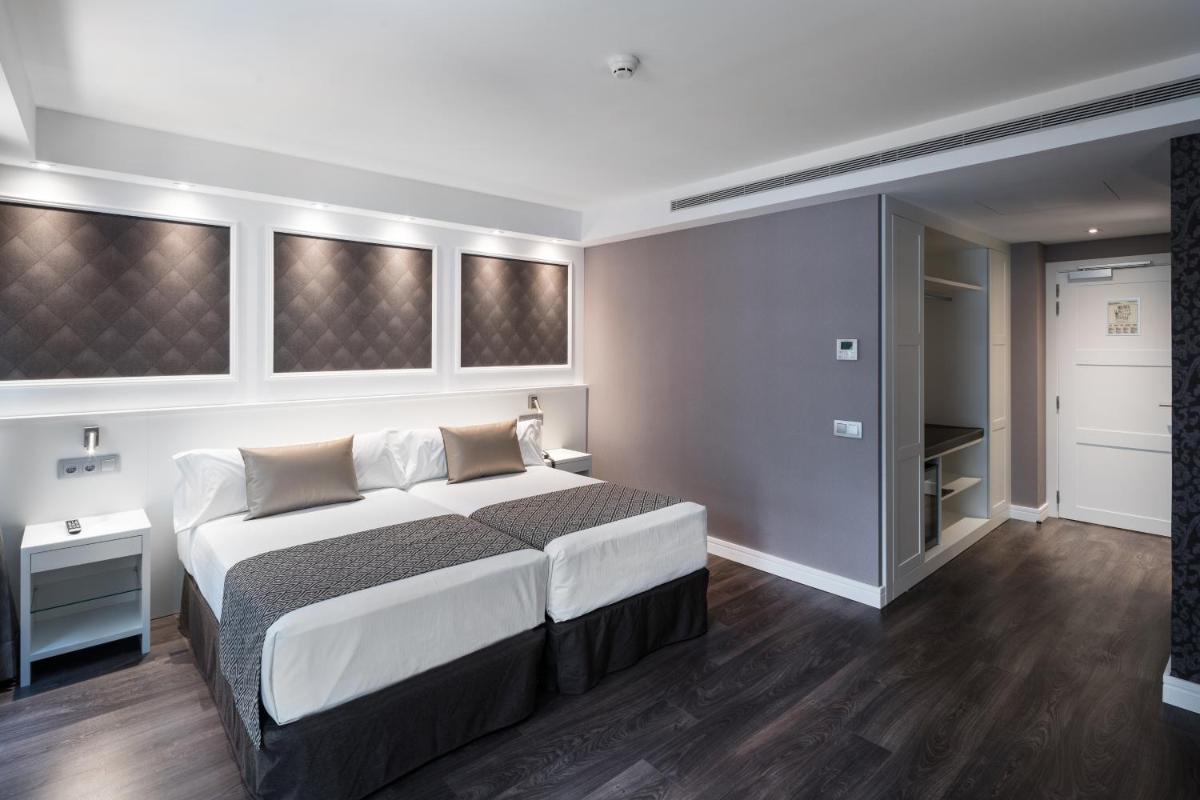 Cama o camas de una habitación en Catalonia Magdalenes